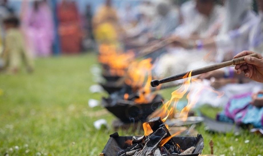 Row of yajna fires on the lawn